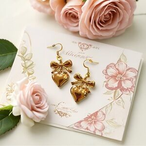 Gold Toned Puffed Heart and Bow Earrings
